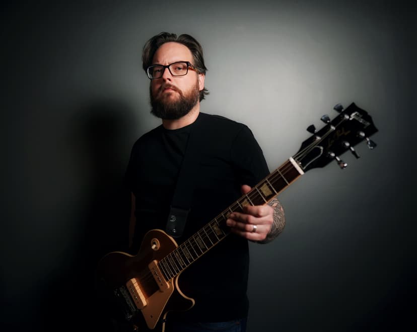 Sean Anthony Sullivan holds Gibson Goldtop Les Paul guitar.